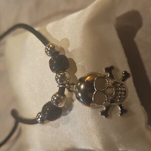 Skull And Crossbones Cord Necklace